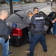 Photo of U.S. Immigration and Customs Enforcement agents performing targeted enforcement operations on February 7 via AP